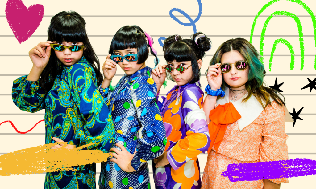 A cut out image from the Linda Lindas' artwork for the single 'Oh!', featuring them all in colourful clothes and sunglasses with the word "Oh!" painted in bright colours on each lens. They are against a lined backdrop and colourful scribbles.